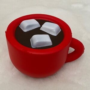 Red Mug Squishy Toy with Hot Cocoa and Marshmallows Design